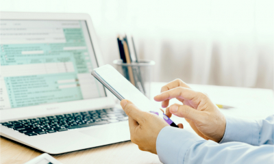 A man completes this tax return using digital tools